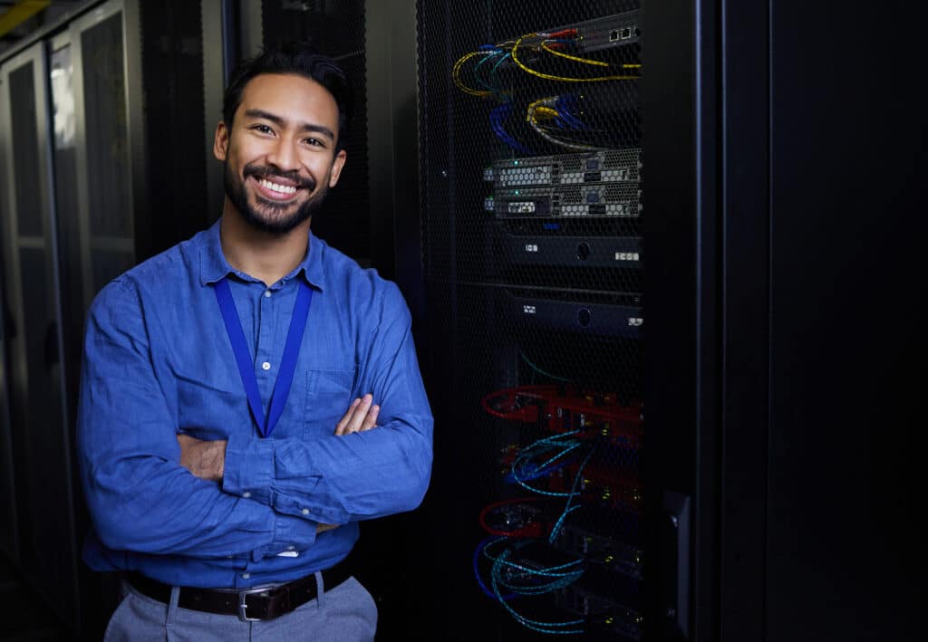 Server room, portrait or happy male developer for online